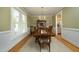Elegant dining room with wooden table, large window, and stylish decor at 1605 Heritage Club Ave, Wake Forest, NC 27587