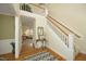Grand foyer with hardwood floors, staircase, and elegant decor at 1605 Heritage Club Ave, Wake Forest, NC 27587