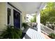Charming front porch with a blue door and comfortable seating at 1605 Heritage Club Ave, Wake Forest, NC 27587