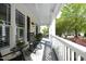 Covered front porch features a comfortable seating area at 1605 Heritage Club Ave, Wake Forest, NC 27587