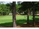 Picturesque golf course view framed by trees, showcasing the lush green and community setting at 1605 Heritage Club Ave, Wake Forest, NC 27587