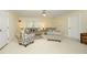 Living room area with neutral furniture, area rug, and a ceiling fan at 1605 Heritage Club Ave, Wake Forest, NC 27587