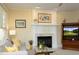 Inviting living room with fireplace, neutral decor, and comfortable seating provides a relaxing atmosphere at 1605 Heritage Club Ave, Wake Forest, NC 27587
