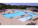 Community pool with ample seating, water features, and recreational swimming areas at 1605 Heritage Club Ave, Wake Forest, NC 27587