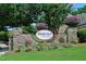 Stone sign at Heritage Wake Forest entrance landscaped with flowers and greenery at 1605 Heritage Club Ave, Wake Forest, NC 27587