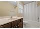 Bathroom featuring a single sink, white shower curtain and white tile floors at 1614 Finnsbury Dr, Burlington, NC 27217