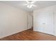 Bedroom featuring ceiling fan, wood floors and large closets at 1614 Finnsbury Dr, Burlington, NC 27217