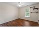 Bedroom with a ceiling fan, hardwood floors, window and shelving at 1614 Finnsbury Dr, Burlington, NC 27217