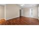A bedroom features hardwood floors, neutral walls, a ceiling fan, a doorway to an adjoining bath, and a closet at 1614 Finnsbury Dr, Burlington, NC 27217