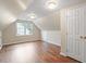 Bonus room featuring wood floors, dormered ceiling and double closets at 1614 Finnsbury Dr, Burlington, NC 27217