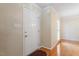 Bright entryway featuring hardwood floors, a neutral color palette, and a white door at 1614 Finnsbury Dr, Burlington, NC 27217