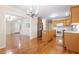 A spacious kitchen with wood floors, a kitchen island, and stainless steel appliances at 1614 Finnsbury Dr, Burlington, NC 27217