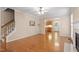 Open-concept living room featuring hardwood floors, a fireplace, and seamless transition to other spaces at 1614 Finnsbury Dr, Burlington, NC 27217