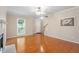Cozy living room featuring hardwood floors, a fireplace, and ample natural light at 1614 Finnsbury Dr, Burlington, NC 27217