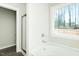 This bathroom features a tub and shower combination next to a window at 175 Tupelo Dr, Spring Hope, NC 27882