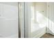 This bathroom features a tub and shower combination, and a towel rack near the window at 175 Tupelo Dr, Spring Hope, NC 27882