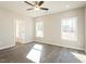 This bedroom features a ceiling fan, gray walls, white trim, and wood-look flooring at 175 Tupelo Dr, Spring Hope, NC 27882