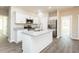 Modern kitchen with stainless steel appliances, granite countertops, and a large island at 175 Tupelo Dr, Spring Hope, NC 27882