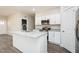 Spacious kitchen with a central island, stainless appliances, and stylish white cabinetry at 175 Tupelo Dr, Spring Hope, NC 27882