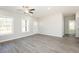 Inviting living room with lots of natural light, ceiling fan, and a view into the kitchen at 175 Tupelo Dr, Spring Hope, NC 27882