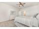 Bright and airy bedroom with carpet, closet, ceiling fan, and natural light for a comfortable living space at 19 Cecina Ct, Clayton, NC 27527