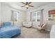 bedroom features a full bed, crib, rocking chair and neutral carpet at 19 Cecina Ct, Clayton, NC 27527