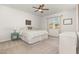 Cozy bedroom with neutral tones, ceiling fan, and natural light creating a relaxing atmosphere at 19 Cecina Ct, Clayton, NC 27527