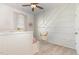 Cozy bedroom featuring a unique accent wall, modern ceiling fan, and a decorative swing at 19 Cecina Ct, Clayton, NC 27527