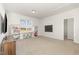 Spacious bonus room with built-in shelving, a study nook with chairs, and ample natural light at 19 Cecina Ct, Clayton, NC 27527