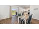 Dining area flows into a white kitchen and features a sliding door to the outdoor patio at 19 Cecina Ct, Clayton, NC 27527