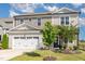 Inviting home showcasing a lush green lawn, lovely landscaping, and a spacious attached garage at 19 Cecina Ct, Clayton, NC 27527