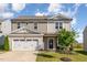 Two-story home featuring a two-car garage, landscaped yard, and charming front entrance with a 'Welcome' sign at 19 Cecina Ct, Clayton, NC 27527