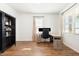 Bright office space featuring a desk, chair, bookcase, and natural light from large windows at 19 Cecina Ct, Clayton, NC 27527