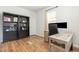 Well-lit home office with modern desk, shelving and hardwood floors, perfect for work or study at 19 Cecina Ct, Clayton, NC 27527