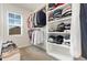 Spacious walk-in closet with ample shelving and hanging space for organized storage solutions at 19 Cecina Ct, Clayton, NC 27527