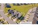 Aerial view of a property in a neighborhood with many houses and some trees and green spaces at 1904 Birdhouse Ln, Wake Forest, NC 27587
