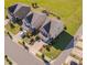 This is an aerial view of the home and surrounding landscape in a suburban community at 1904 Birdhouse Ln, Wake Forest, NC 27587