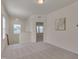 Spacious bonus room with plush carpeting, natural light, and neutral paint tones throughout at 1904 Birdhouse Ln, Wake Forest, NC 27587