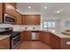 Bright kitchen featuring stainless steel appliances, granite countertops, and a white subway tile backsplash at 1904 Birdhouse Ln, Wake Forest, NC 27587