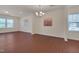 Large, versatile room with ample natural light, wood-look floors and neutral walls for personalized decor at 1904 Birdhouse Ln, Wake Forest, NC 27587