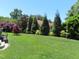 Green backyard features lush grass and landscaping at 2000 Howson Rd, Raleigh, NC 27603