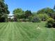 Lush backyard featuring manicured lawn and a bird bath at 2000 Howson Rd, Raleigh, NC 27603