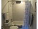 Well-lit bathroom features a shower and tub combination with decorative tile accents at 2000 Howson Rd, Raleigh, NC 27603