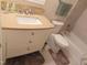 Bathroom with vanity sink, neutral color scheme, and tiled walls for a clean look at 2000 Howson Rd, Raleigh, NC 27603