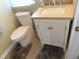 Bright bathroom featuring a vanity with a cream countertop and cabinet storage at 2000 Howson Rd, Raleigh, NC 27603