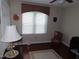 Cozy bedroom with a window, hardwood floors, rug and furniture at 2000 Howson Rd, Raleigh, NC 27603
