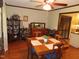 Dining room with wood flooring and a ceiling fan, adjacent to the kitchen at 2000 Howson Rd, Raleigh, NC 27603