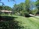 Inviting one story home featuring a lovely front yard and mature landscaping at 2000 Howson Rd, Raleigh, NC 27603