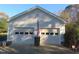 Spacious two-car detached garage with concrete driveway and automatic doors at 2000 Howson Rd, Raleigh, NC 27603