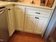 Close-up of kitchen cabinets with decorative trim, hardware, and light countertops at 2000 Howson Rd, Raleigh, NC 27603